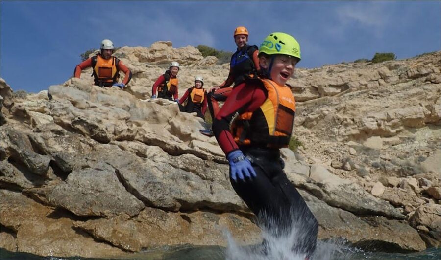 Alicante: Coasteering Adventure on Torres de la Villajoyosa - Swimming through clear water and sea caves