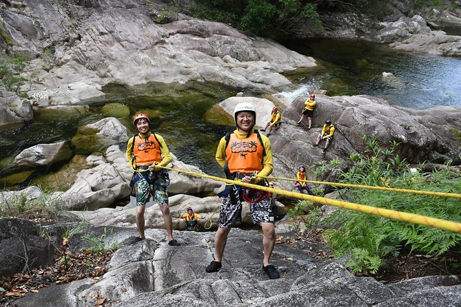 Behana Canyoning Tour by Cairns Waterfalls - Swimming, rock slides, and cliff jumps