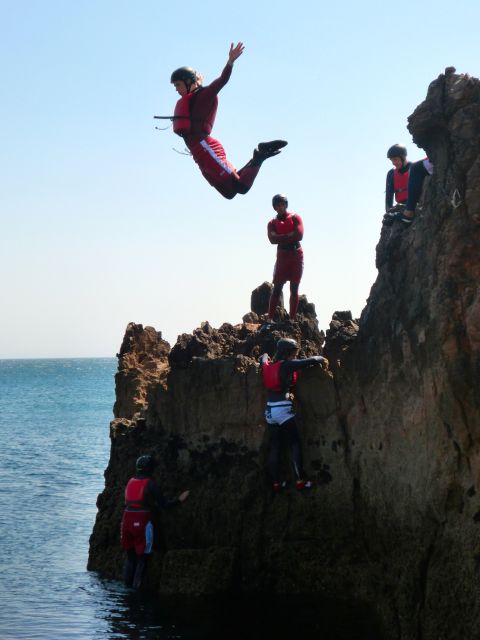 Coasteering Algarve: Cliff Jump, Swim & Climb in Sagres - Swimming through clear water and sea caves