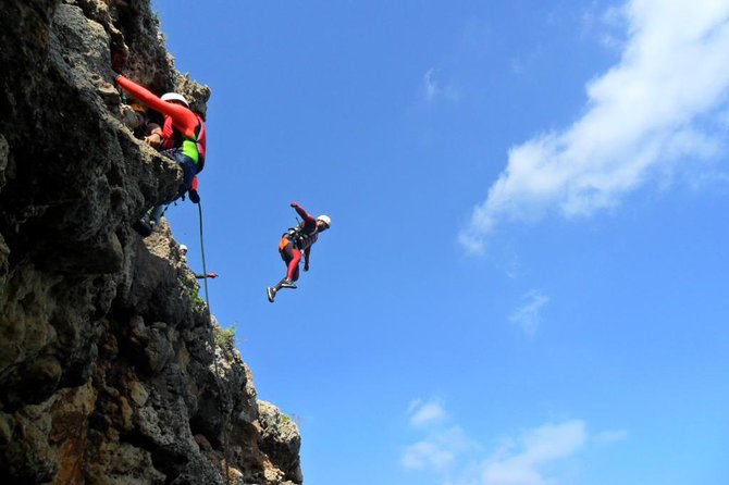 Coasteering at Portinho da Arrábida - Jumps, rappelling, and the final slide