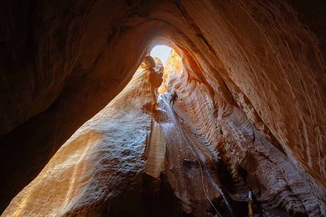 East Zion: Stone Hollow Full-day Canyoneering Adventure - Hiking beneath the red canyon walls